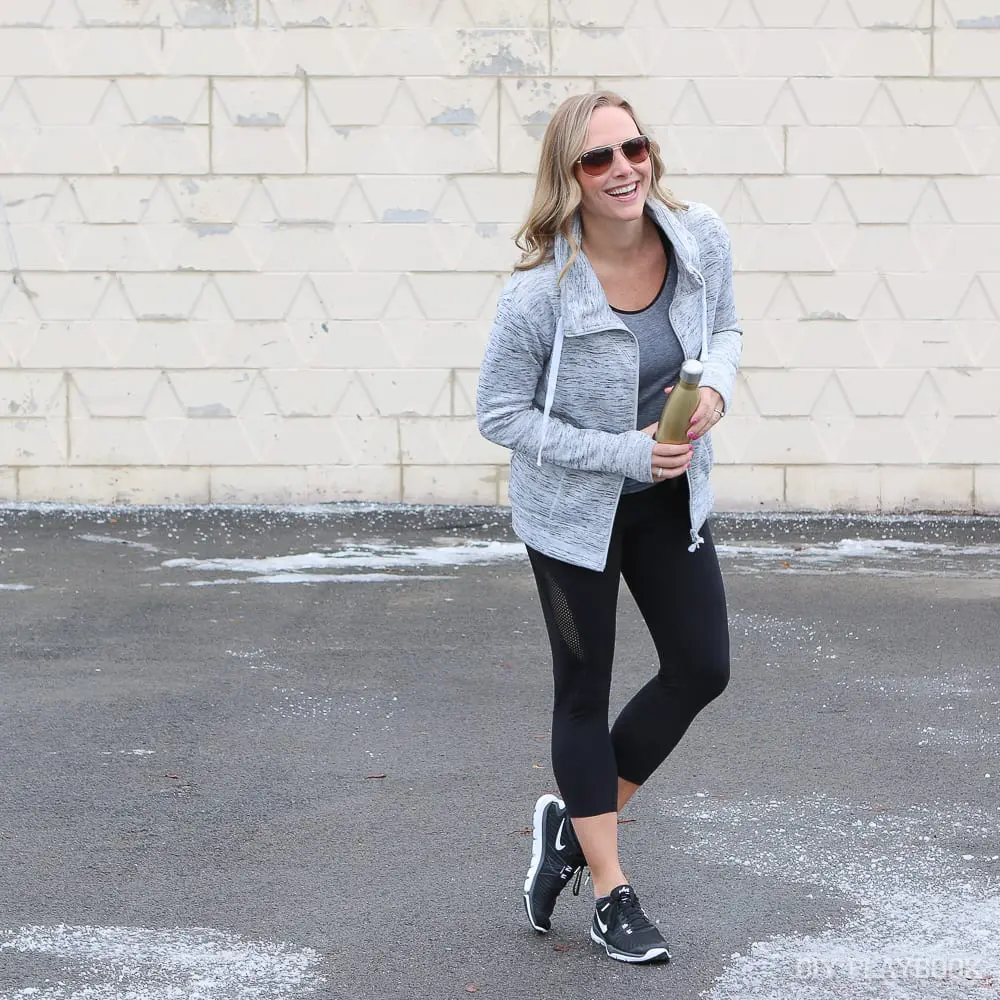 Casey's athleisure zip up is easy to take off after her warm-up once the work out really gets going. 
