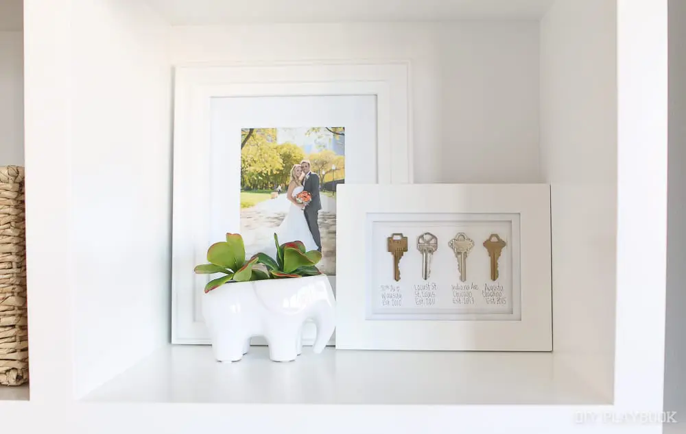 Use a shelf: 6 Ways to Decorate with Picture Frames | DIY Playbook