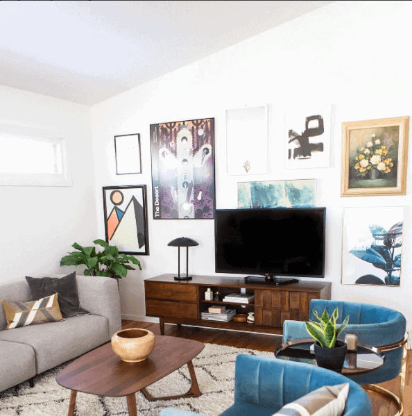 Living room gallery wall designed with large artwork - photo by Simply Grove