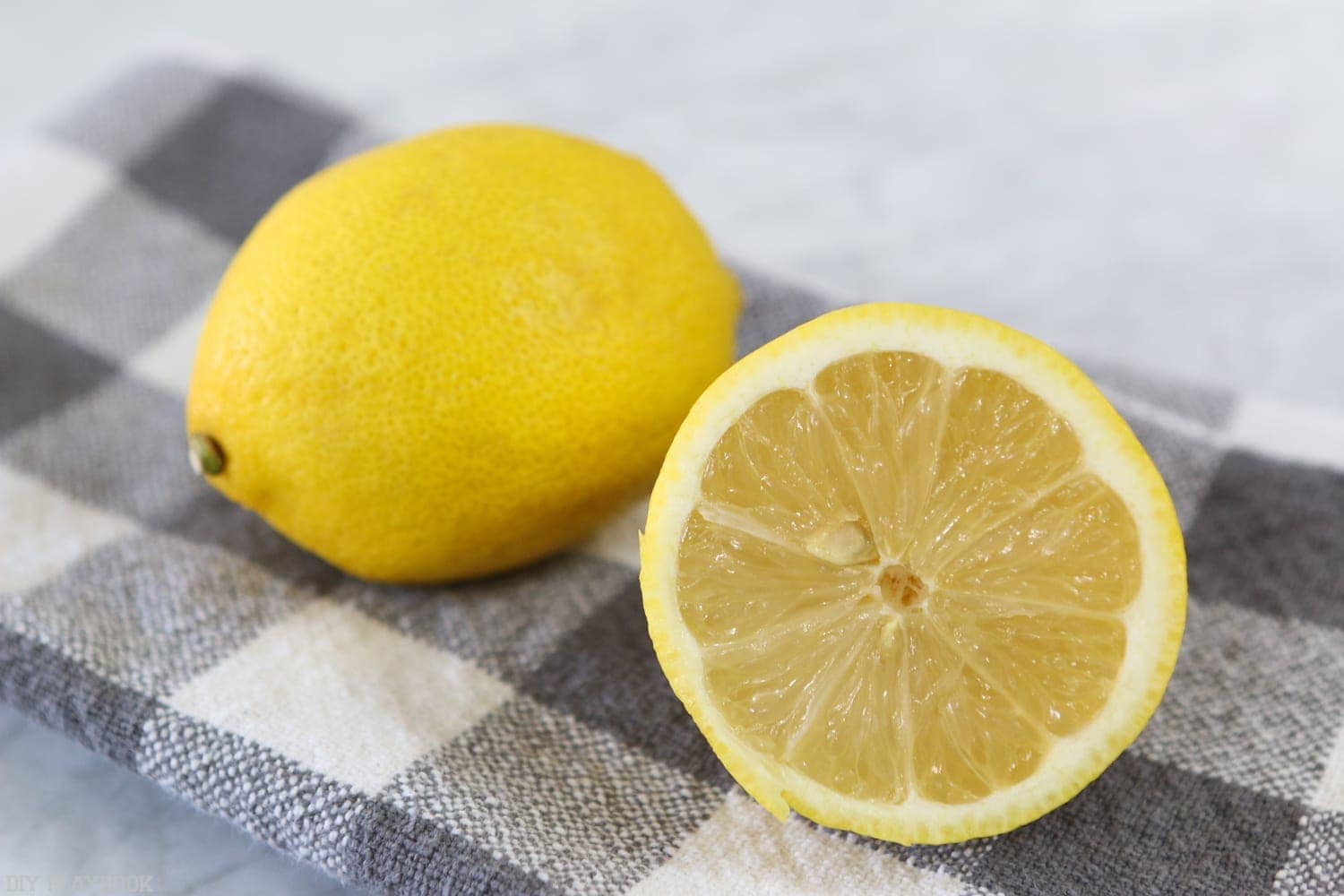 Slice the lemon in half for the stovetop potpourri. 