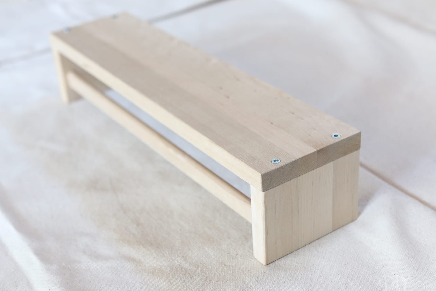 An IKEA shelf is an easy way to do this:  DIY Bookshelves | DIY Playbook