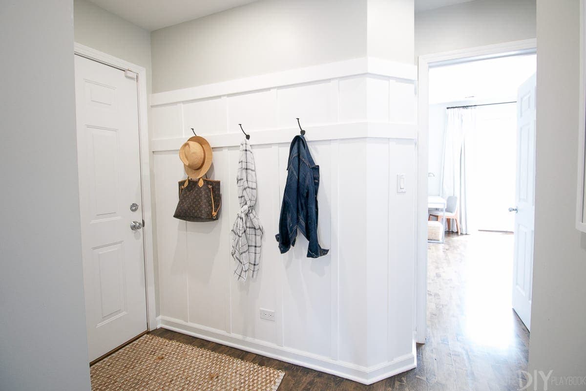 The hallway also got the board and batten treatment! You know we love this look around the DIY Playbook. We use these hooks everyday - I'm so glad we added them!