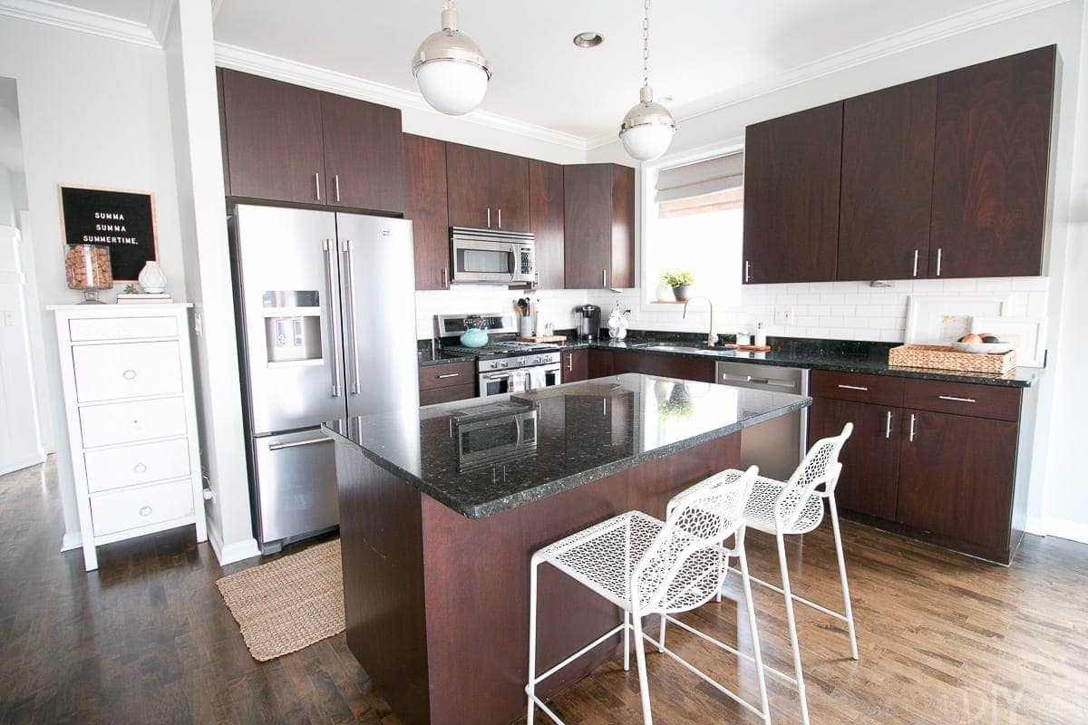 Our Chicago Condo Kitchen has a great kitchen island that adds to our counter space! We love it!