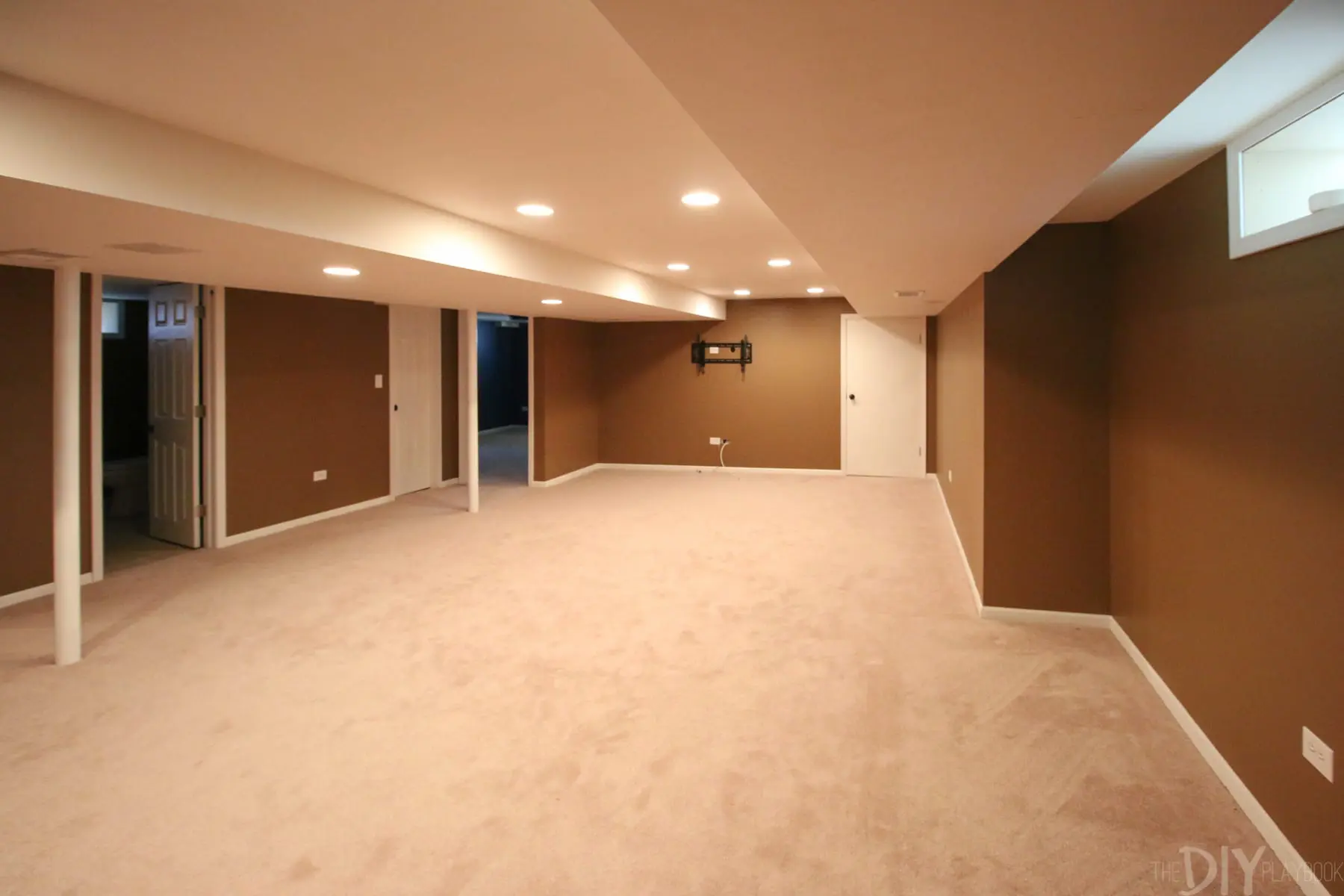 How far our basement has come! Can you believe how brown these walls are? These needed a serious paint job to lighten this space up. 