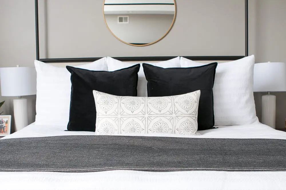 Decorative accent pillows brighten up the bedspread. 