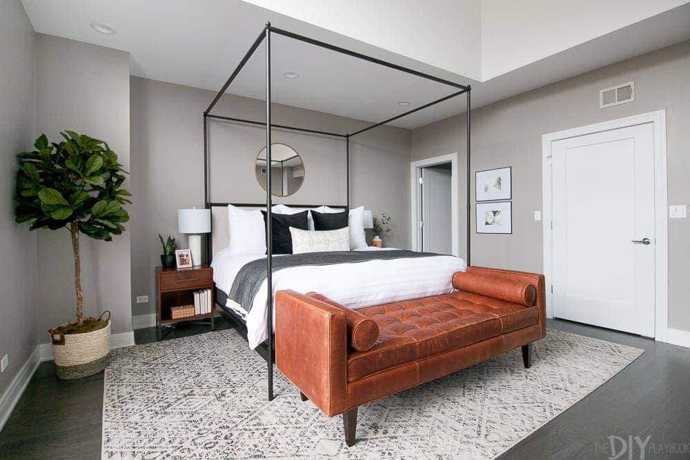 This master bedroom is modern with a city feel. 