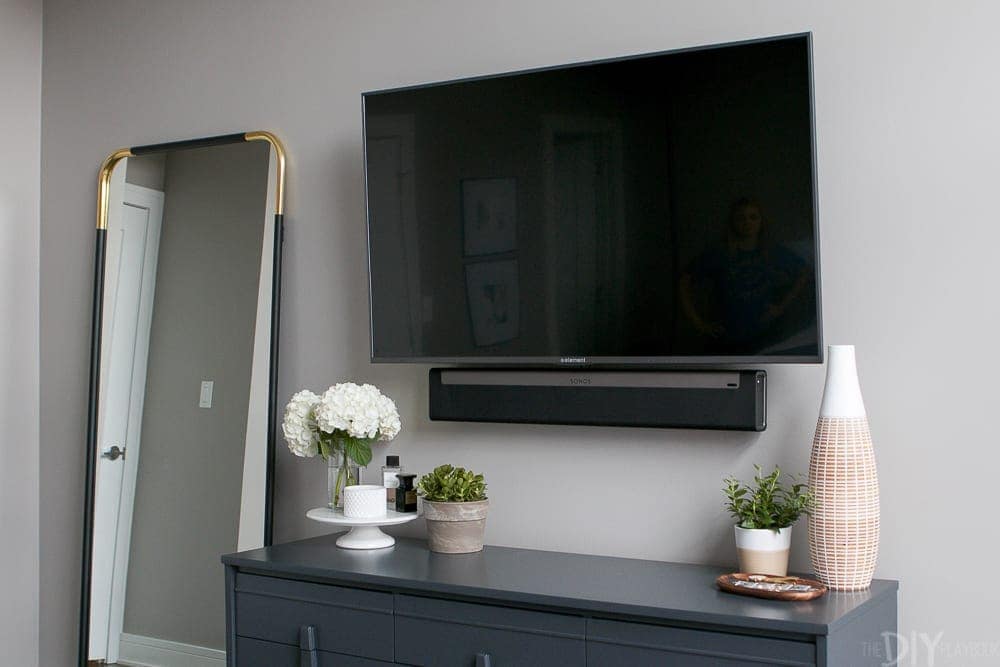Mounting the TV over the dresser saves a lot of space. 