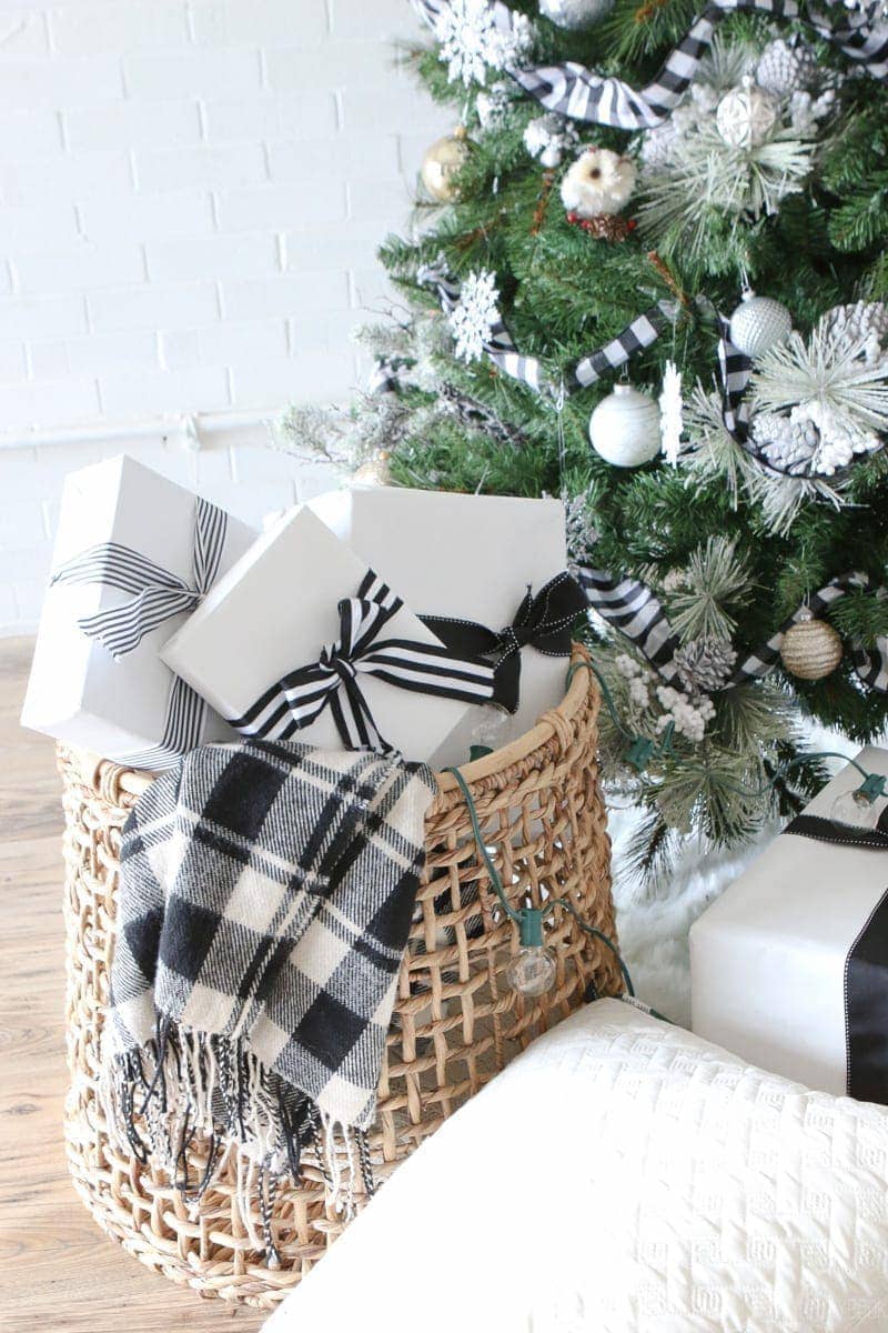 Our black and white tree has a lot of black and white presents underneath it! How cute is that wicker basket too? 