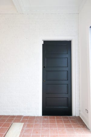 The Mudroom: Painting White Brick and Black Doors