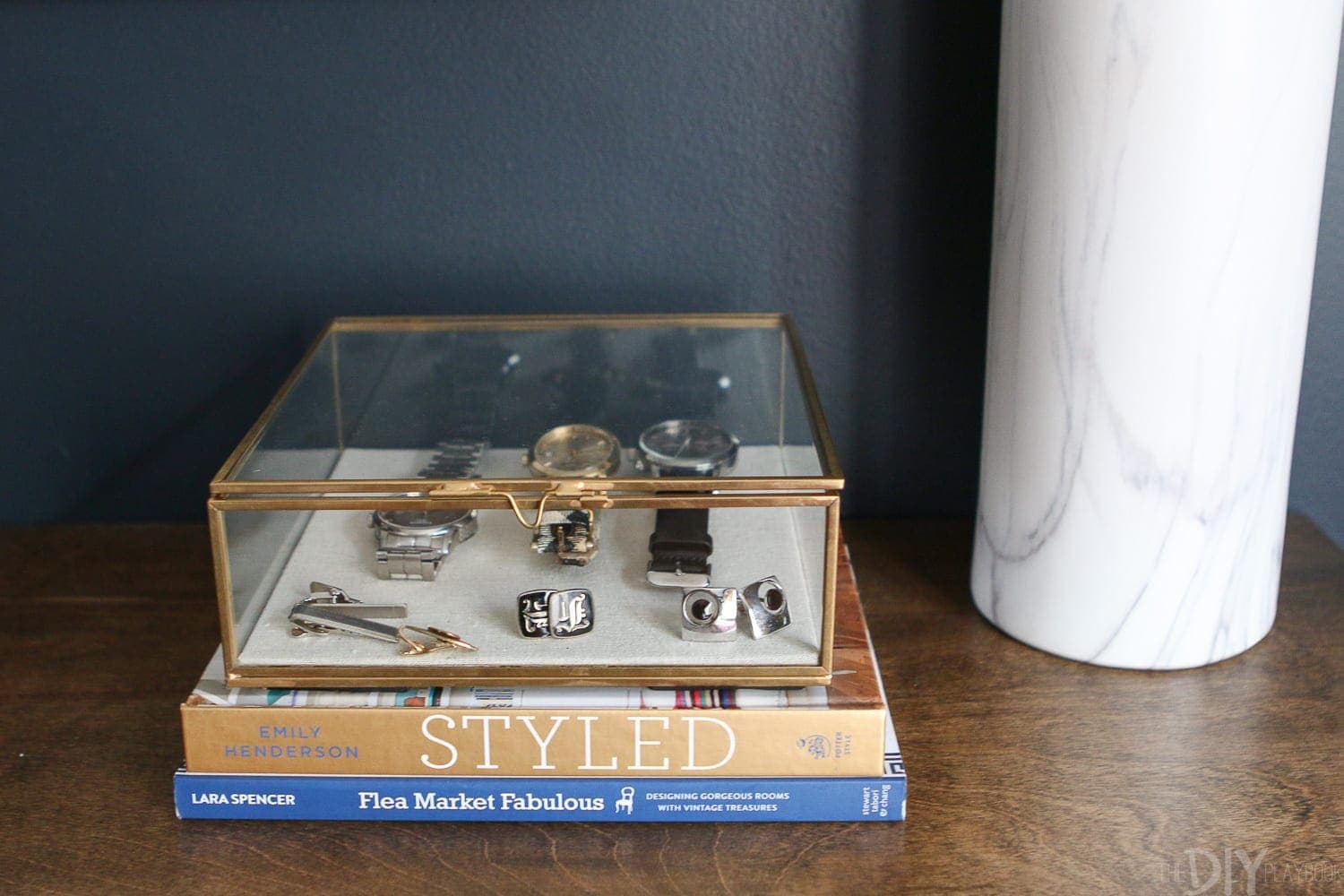 Sleek bedside table display box for watches, cufflinks, and personal accessories. 