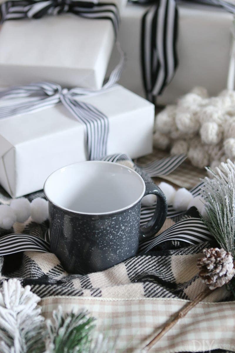 A warm mug of coffee and a comfy blanket on the couch is the perfect way to stay warm on christmas morning. 