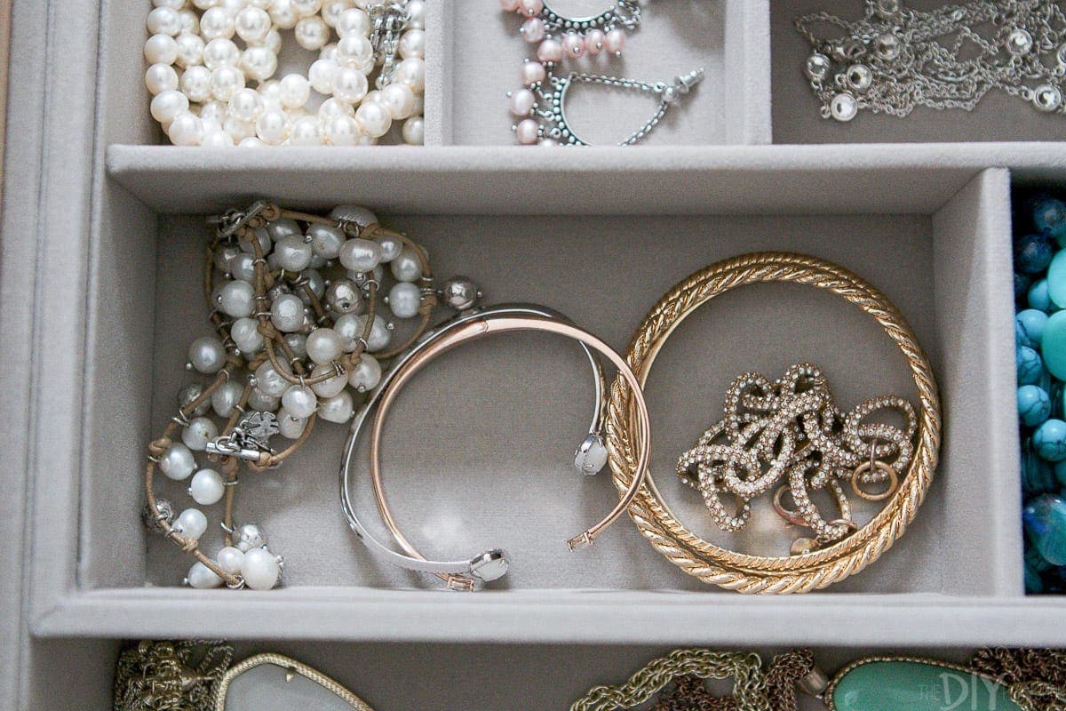 Organized bracelets in a jewelry drawer. 