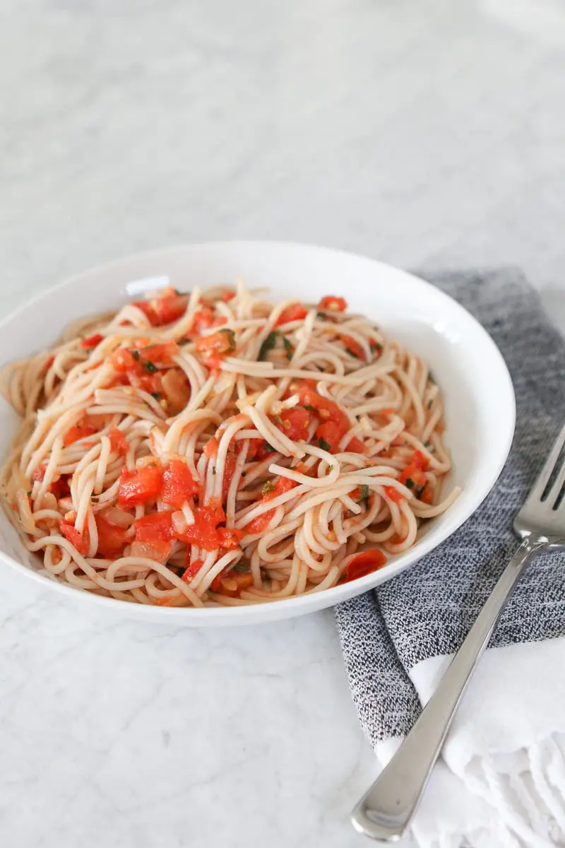 How to make pasta with fresh tomatoes, onion, and garlic for an easy dinner. 