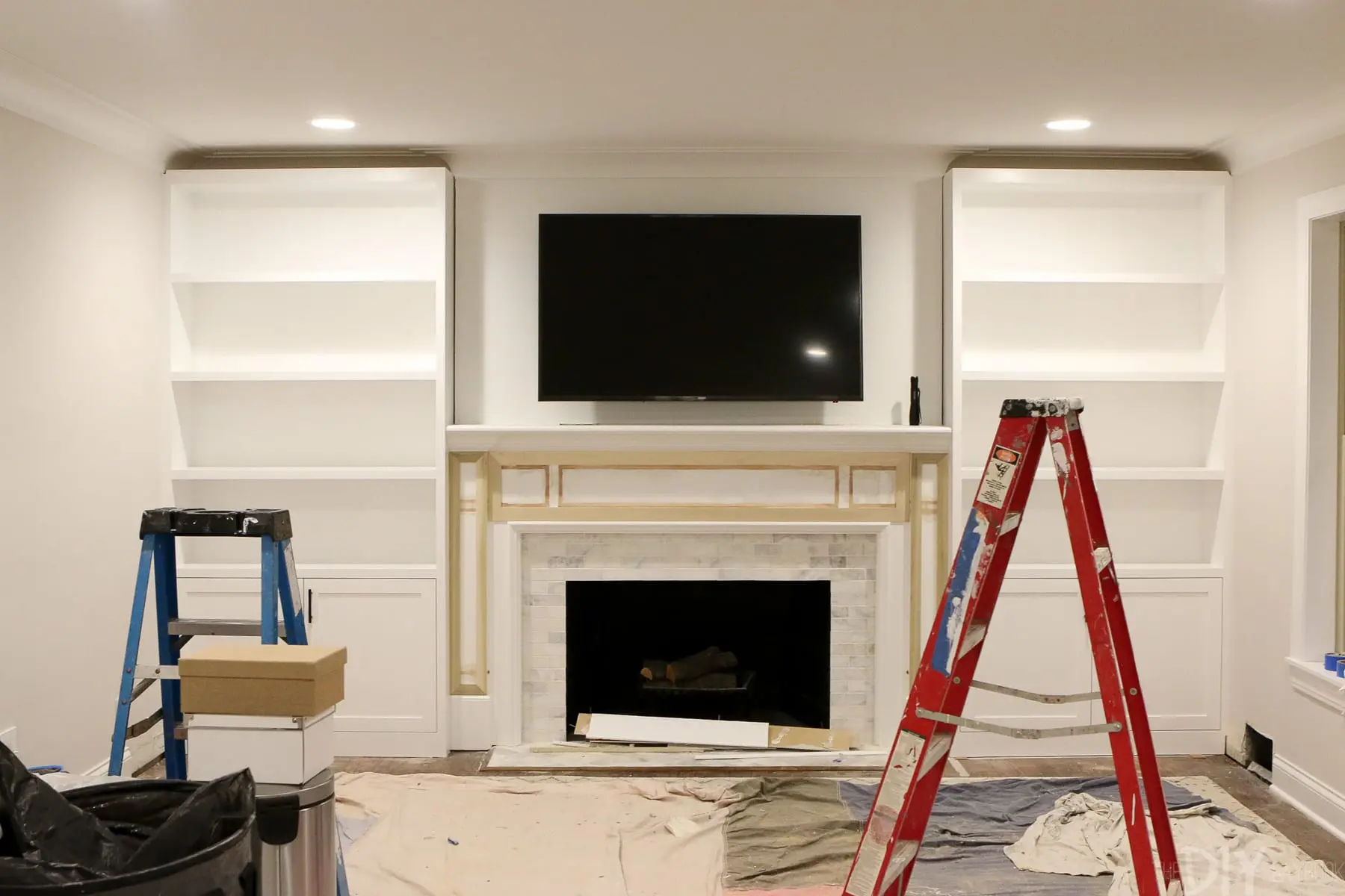 the step by step process of installing Whte Built-Ins Around a Fireplace