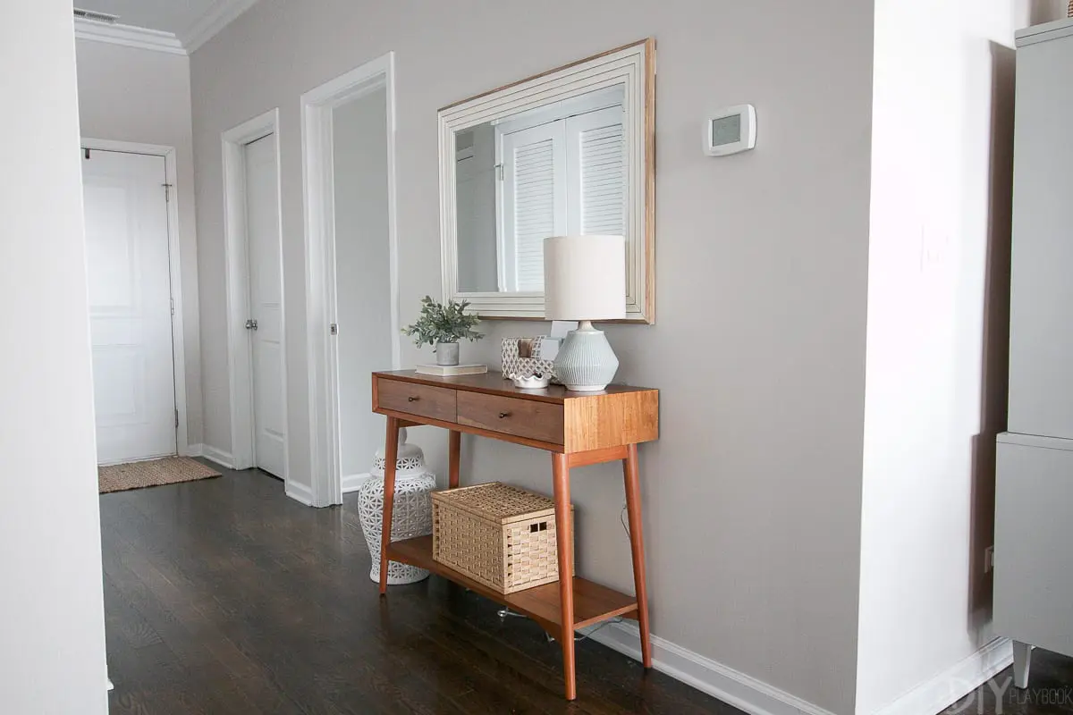 Adding a slim console to an empty hallway creates a functional entryway and drop zone