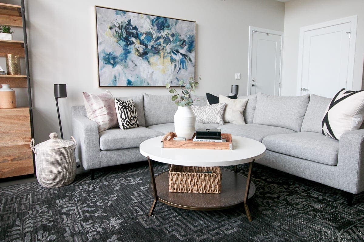 Gray sectional with art in this contemporary condo