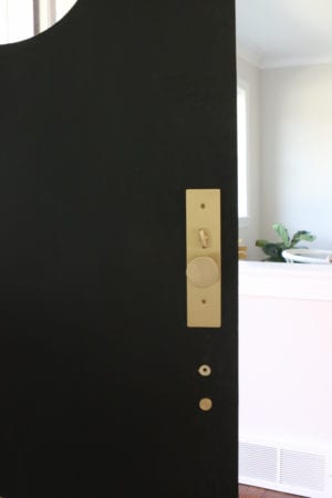 A Black Front Door with Satin Brass Hardware