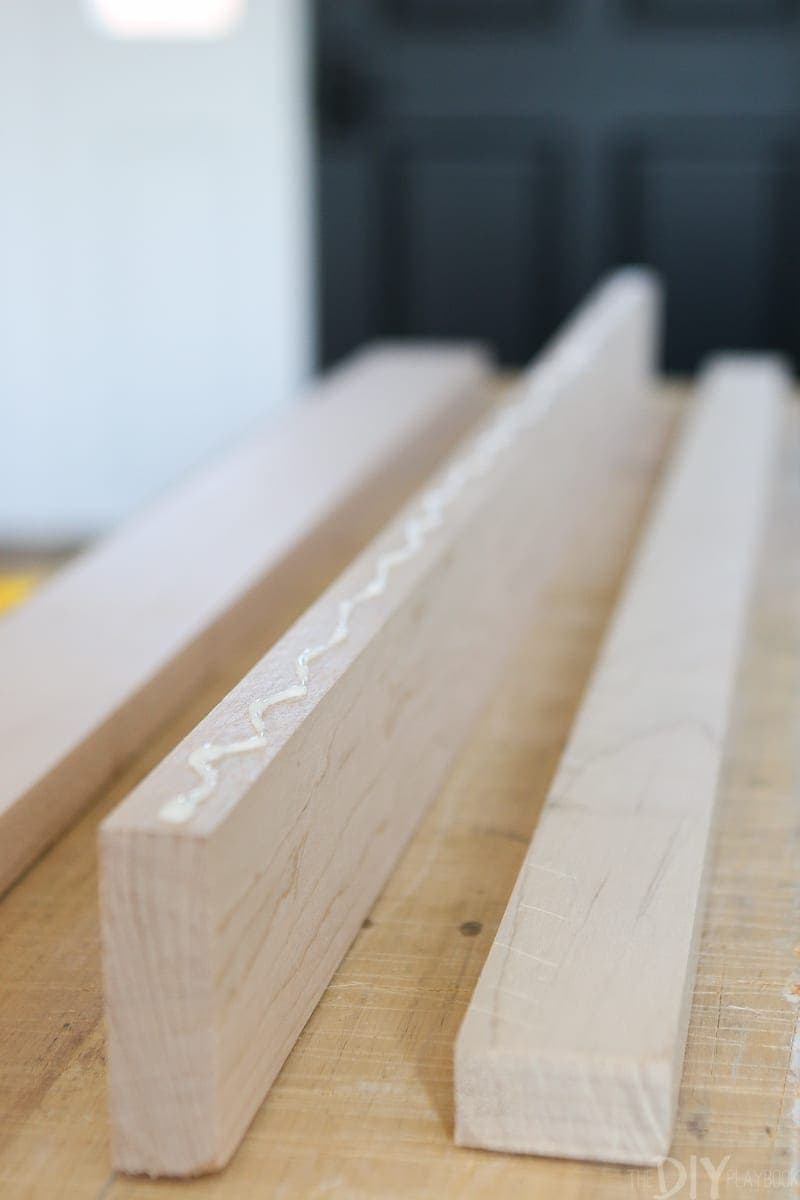 Adding wood glue to DIY book ledges