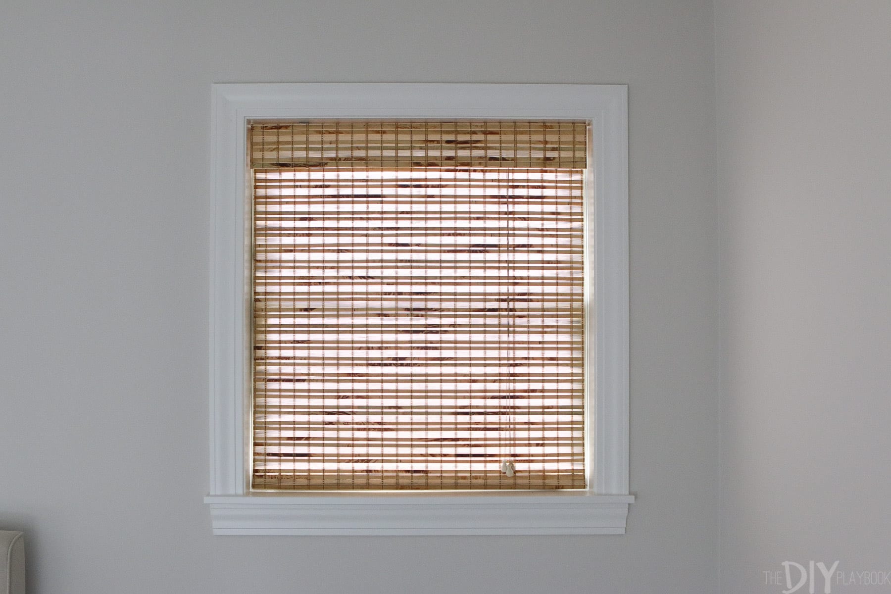 bamboo shades provide privacy in a bedroom and texture