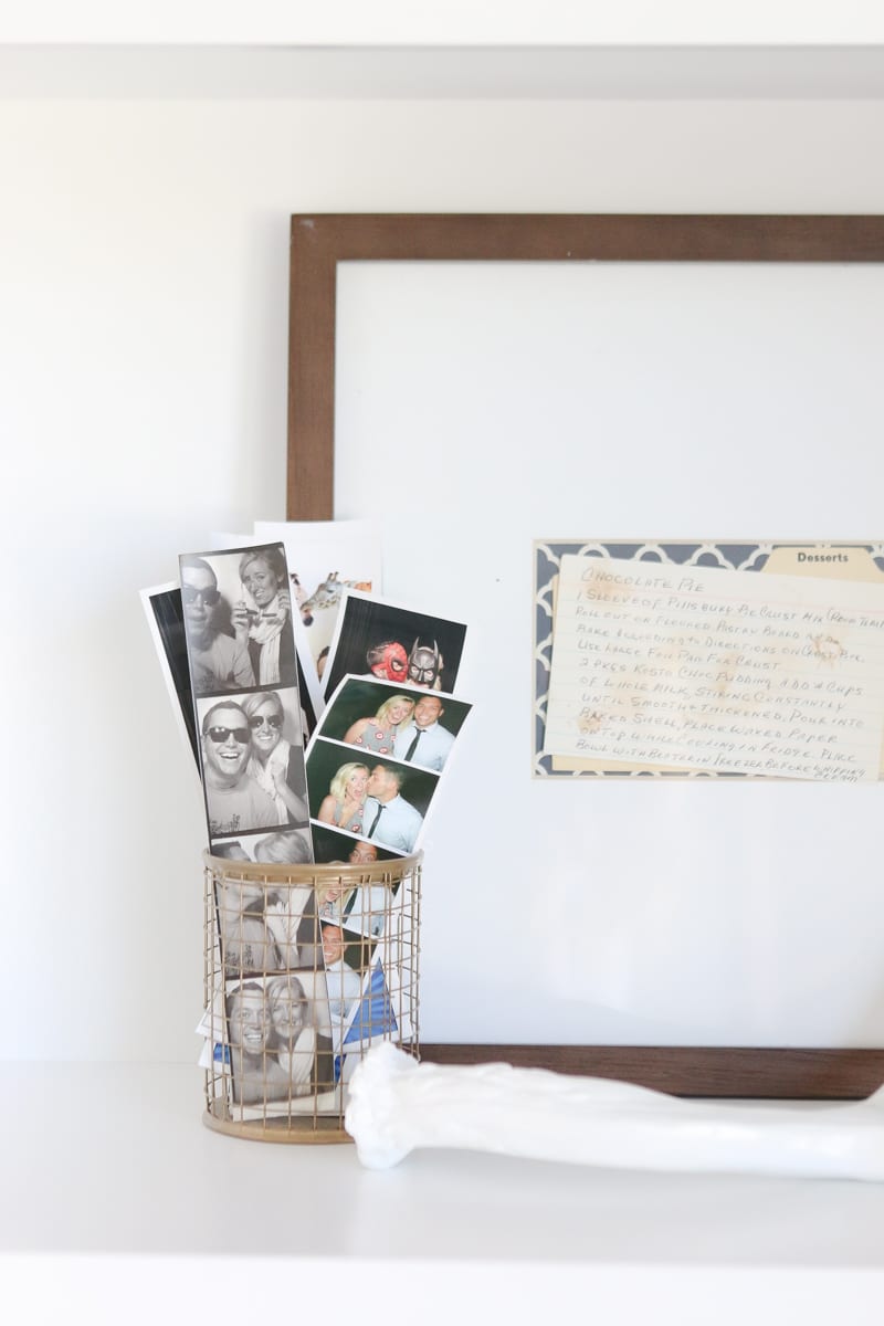 Add photo booth strips to a pencil holder to decorate your built-in shelves. 