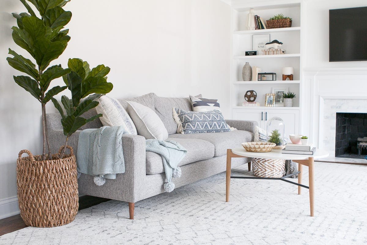 layering pillows and throws to decorate a couch