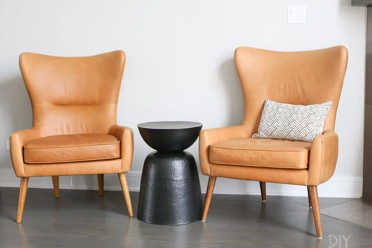 Leather chairs from West Elm add additional seating to this living room space. 