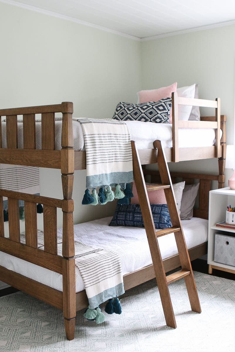 Wood bunkbeds with white bedding