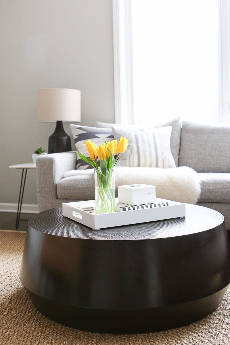 Tips and tricks to style a round coffee table in your home. 