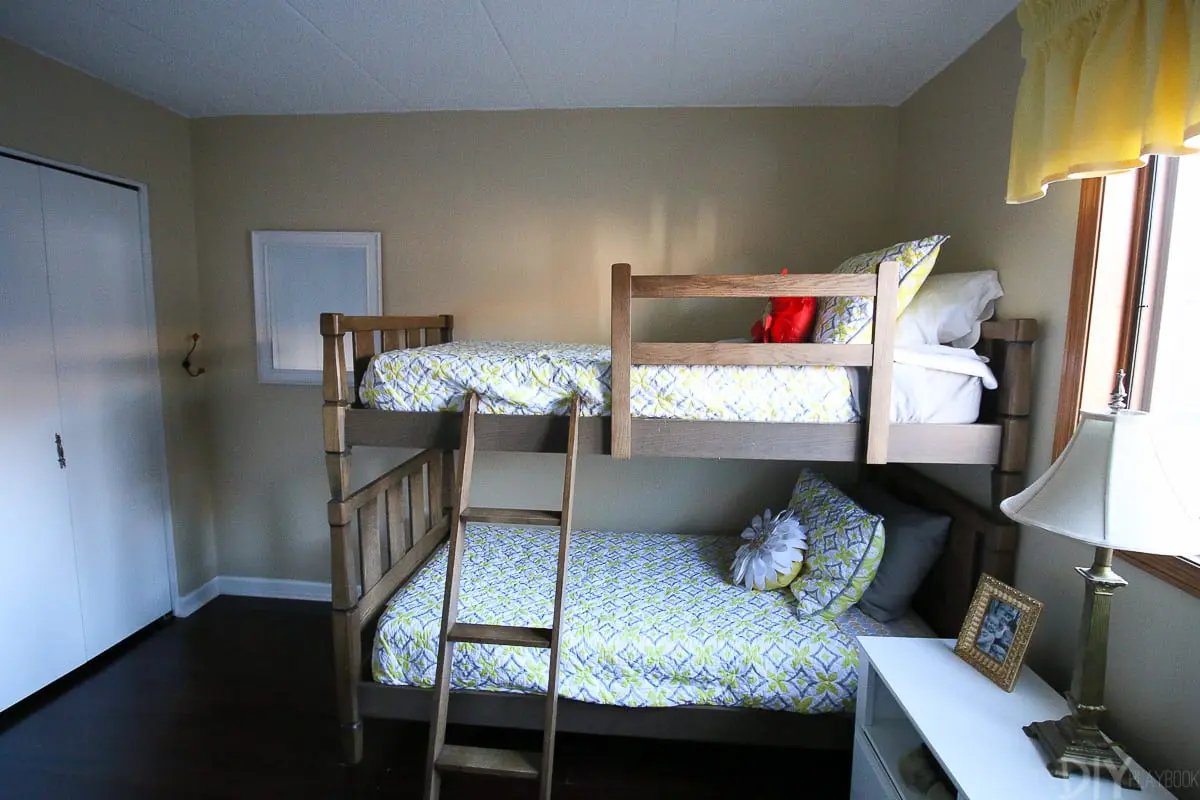 Wood bunk beds in the before photos for a kids' room makeover