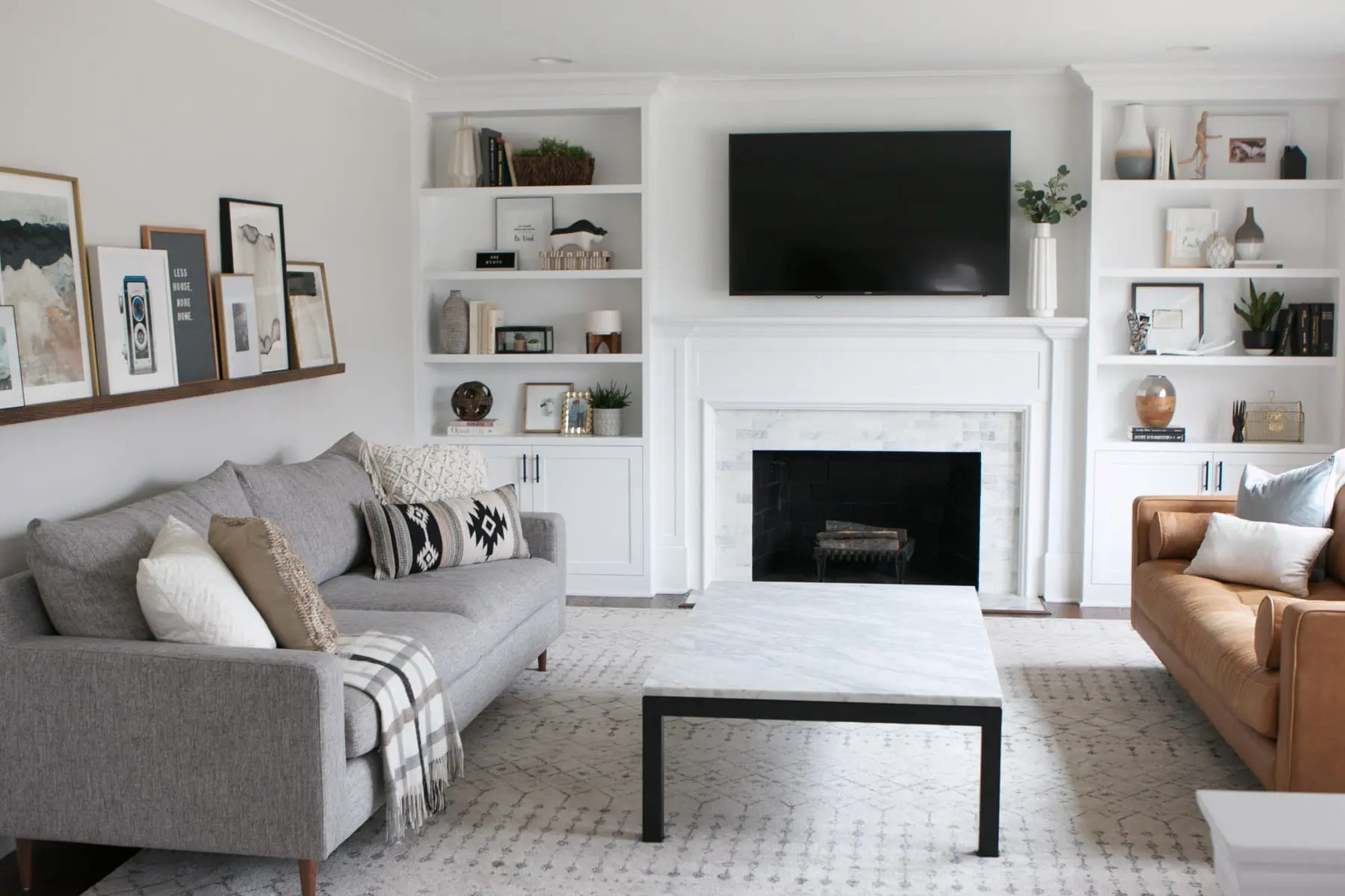 White and gray family room with a marble coffee table. 