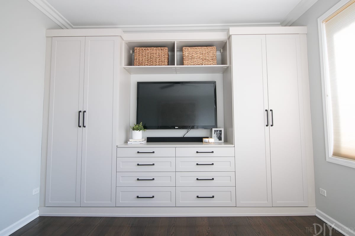 Master bedroom built-ins with a mounted television