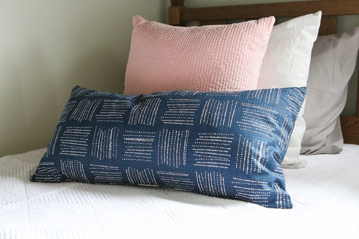 Use a lumbar pillow in front of a standard throw pillow on bunkbeds