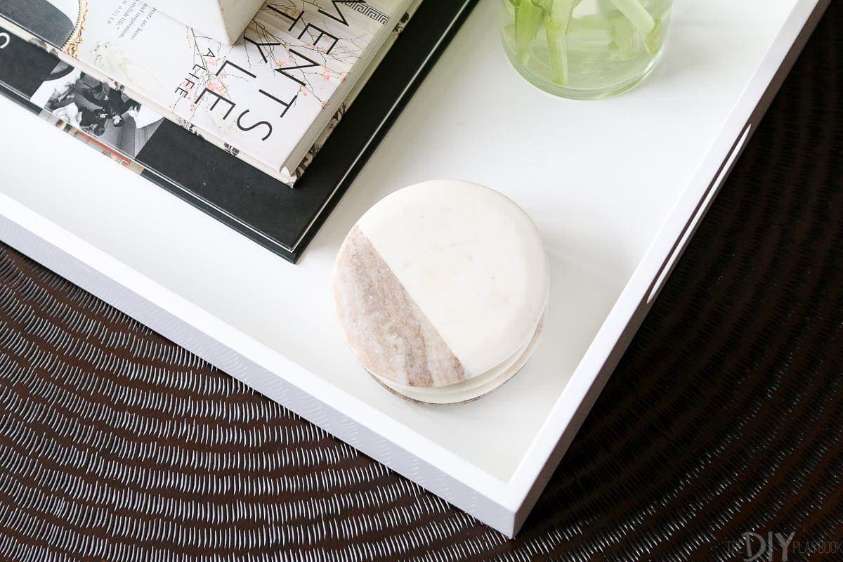 We use marble coasters to keep our coffee table free of water damage. 