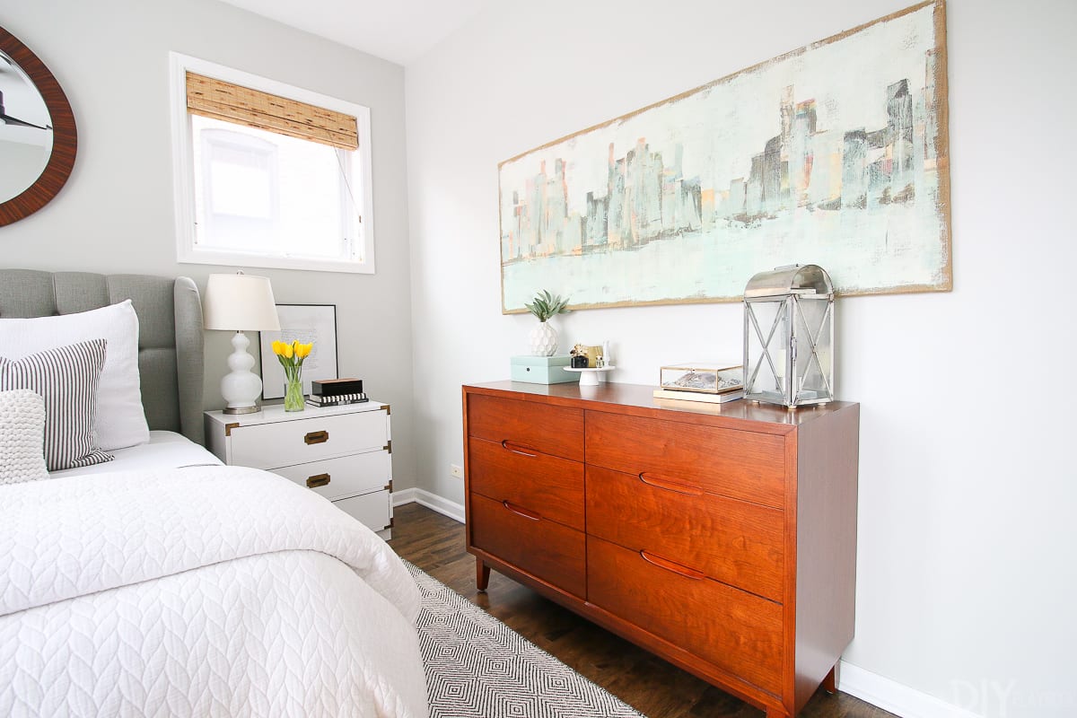 The wood dresser warms up this master bedroom space. 
