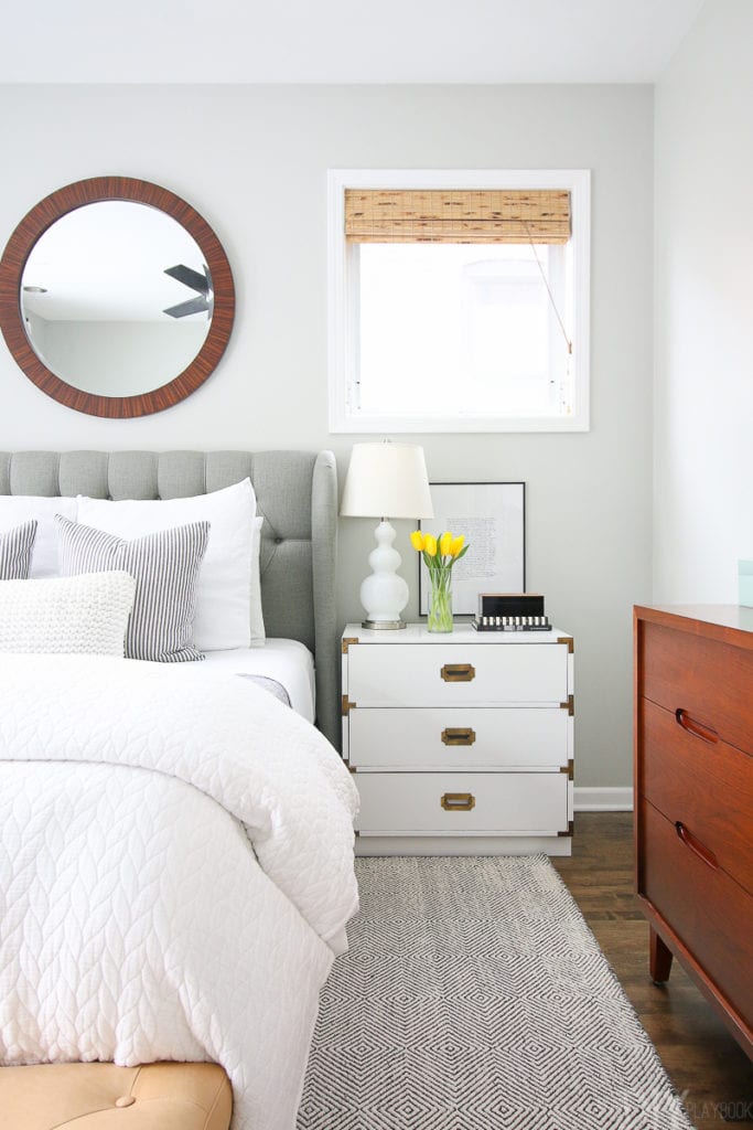 Campaign style nightstand and white bedding