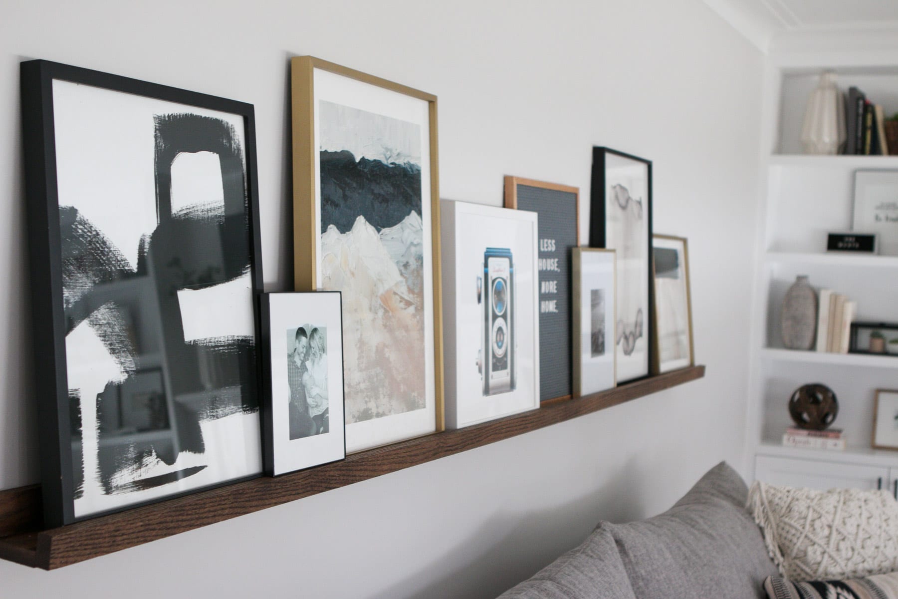 Layer your art on a DIY Picture ledge for a unique look in your living room