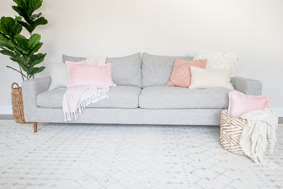 decorating a couch with blush and pinks