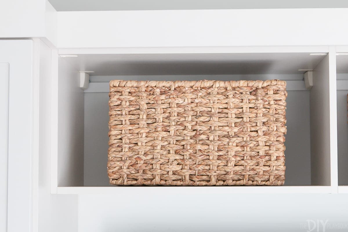 A wicker basket from HomeGoods provides the right amount of texture and more storage. 