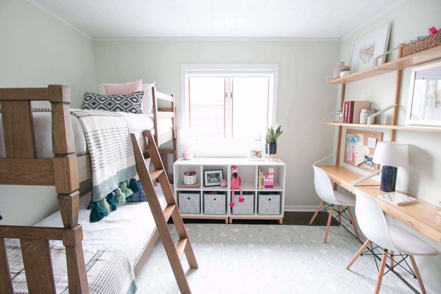 A light and bright kids' room makeover with bunkbeds and 3 desks. 