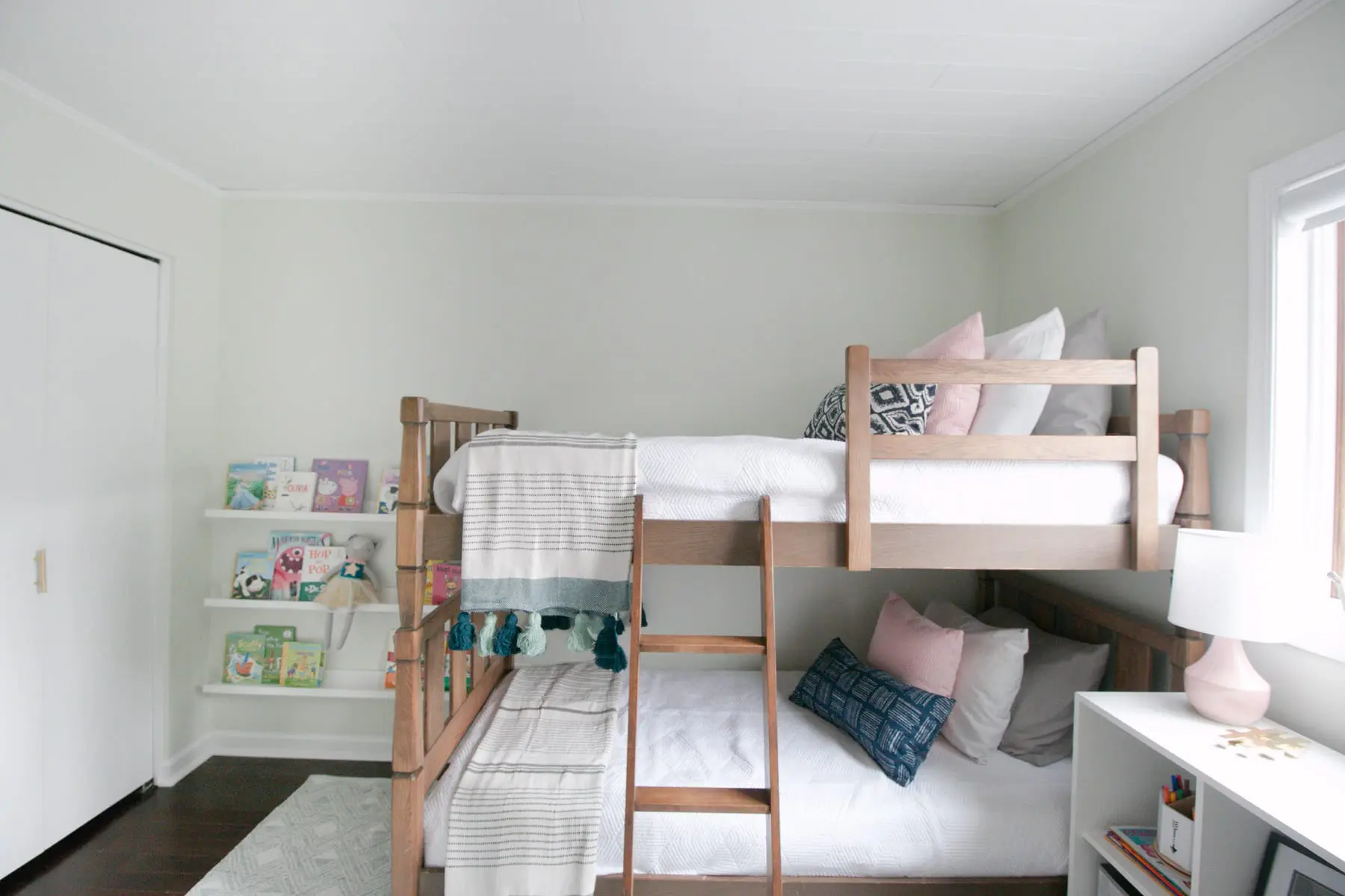 A kids' room makeover with the walls painted the color Sagey. 