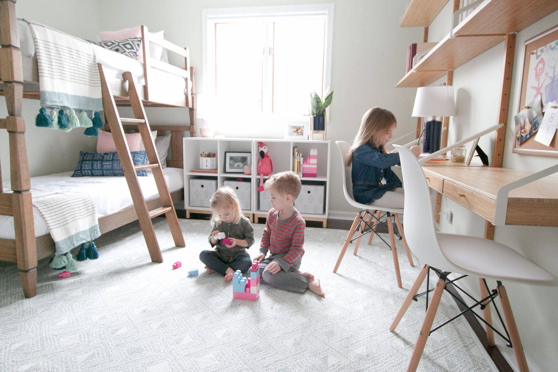Grandkids enjoying the kids' room makeover with space to play and craft. 