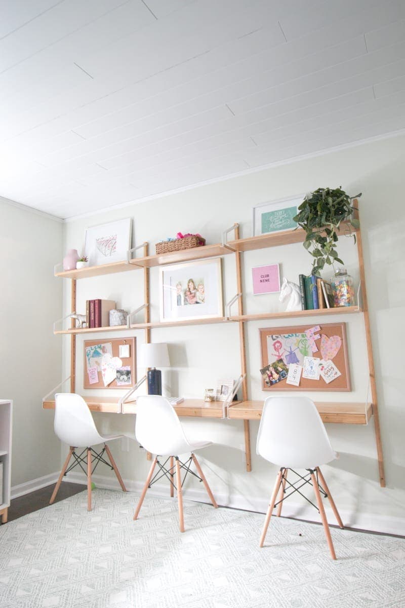 This desk system from Ikea fits this room perfectly and provides storage. 