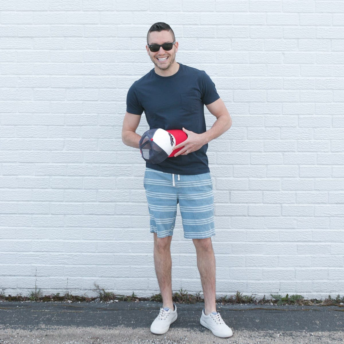 Create a casual look with a t-shirt and striped shorts for men's spring fashion
