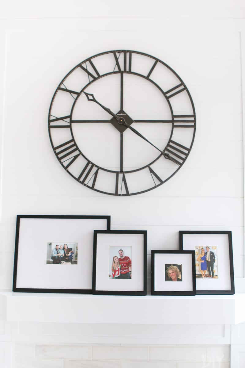 Love this large round industrial clock against this white shiplap background