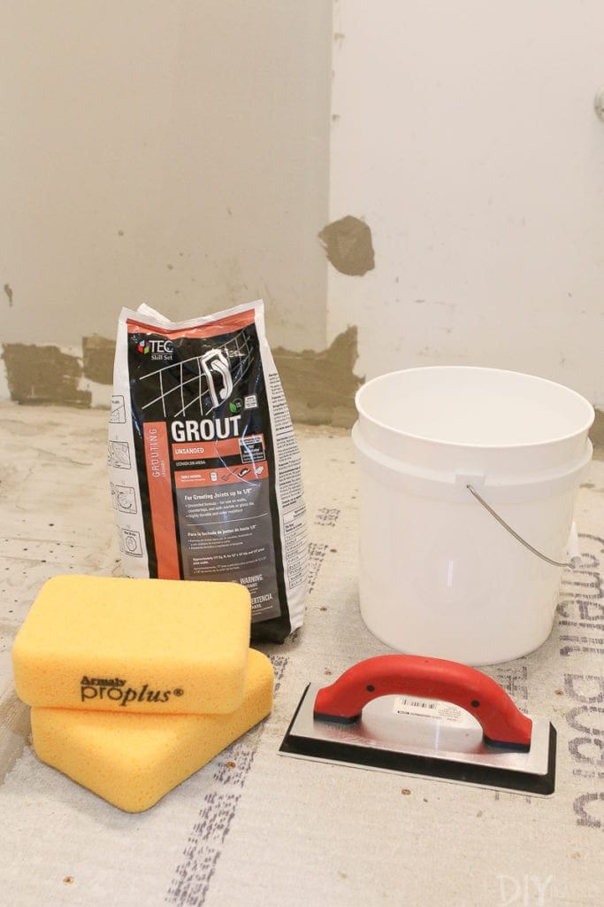 Grouting supplies include a grout float, sponges, and a clean bucket