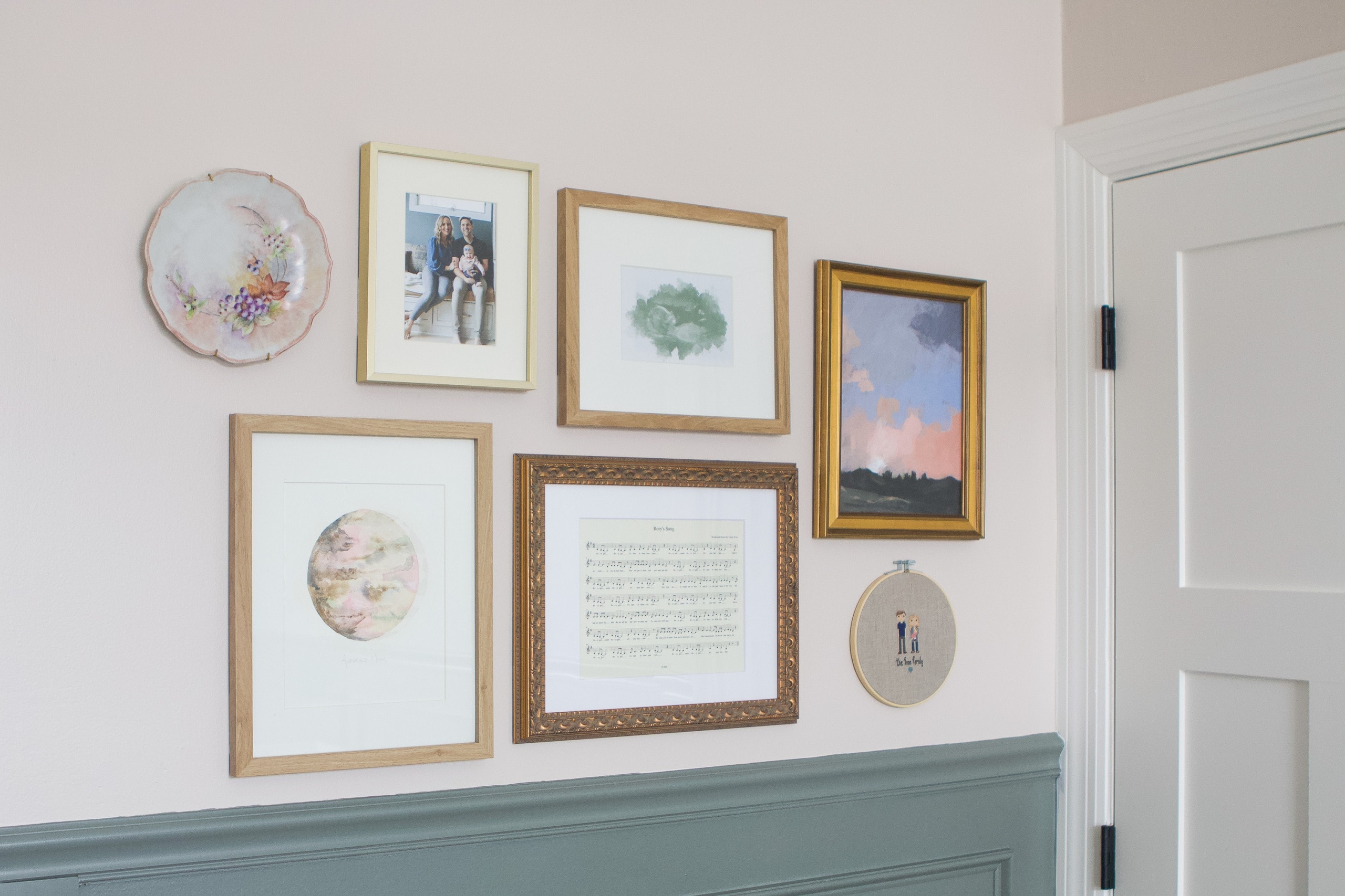 Gallery wall in a nursery with inexpensive art ideas that are easy to do