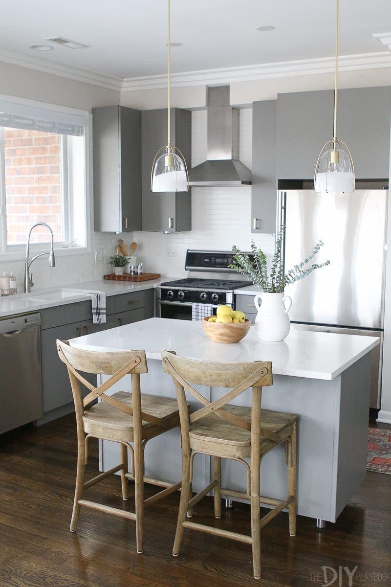 These brass pendants from Rejuvenation are the perfect size for this kitchen