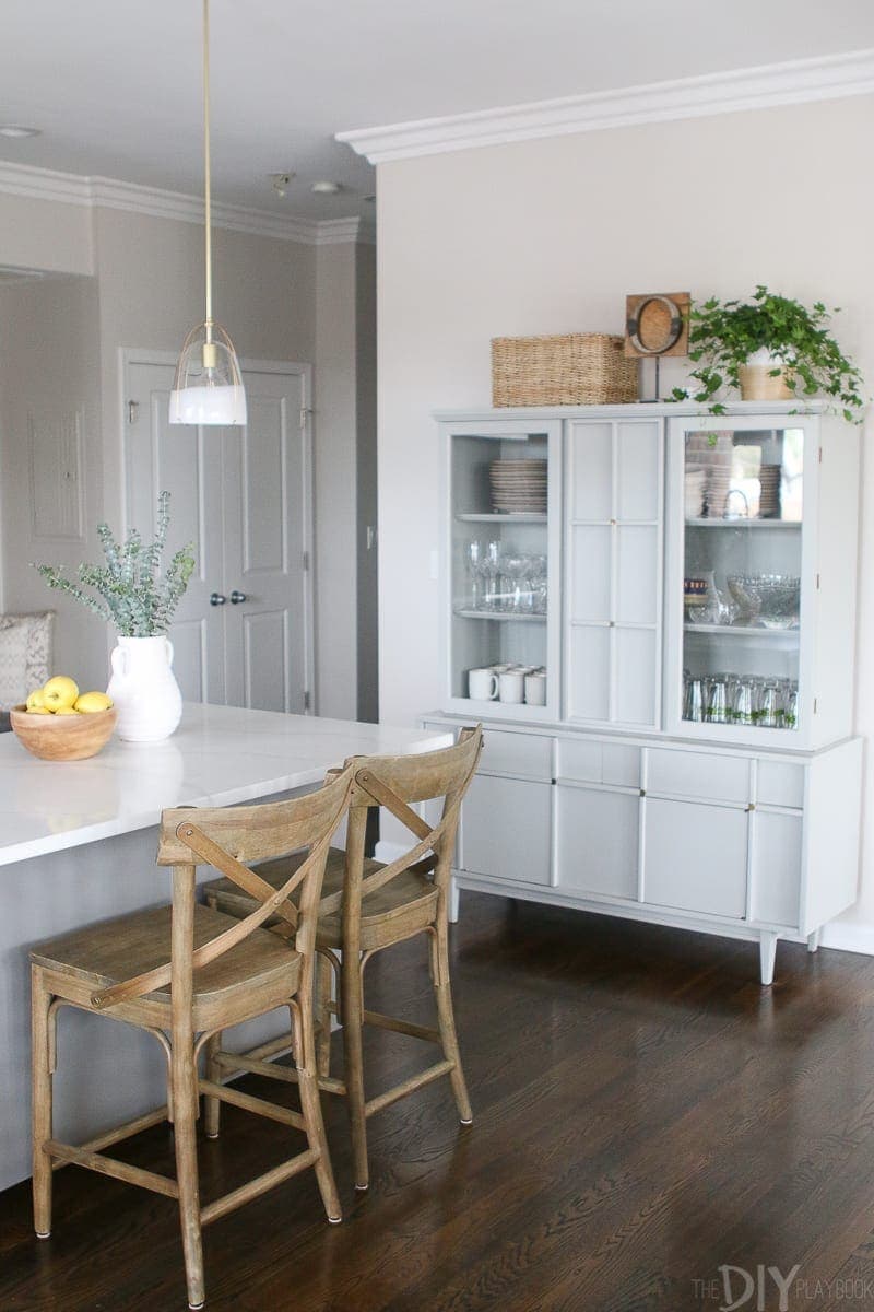 A gray hutch to store kitchen dishes