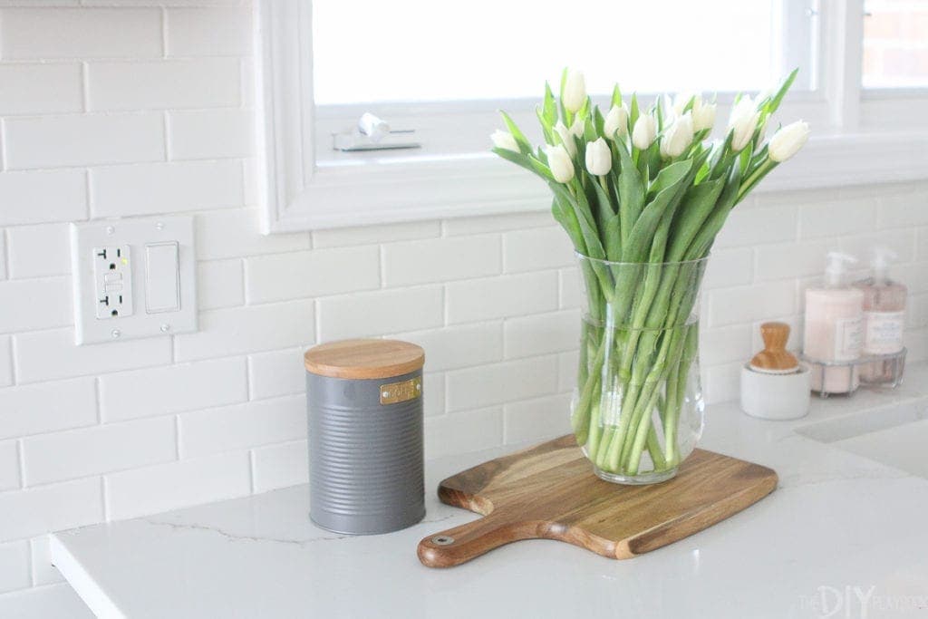 Display fresh flowers on a cutting board in your kitchen