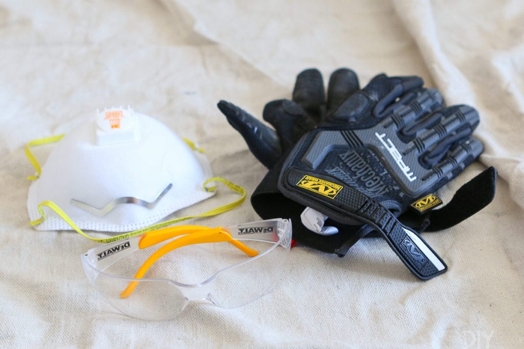 A face mask, gloves, and safety glasses are essential when renovating